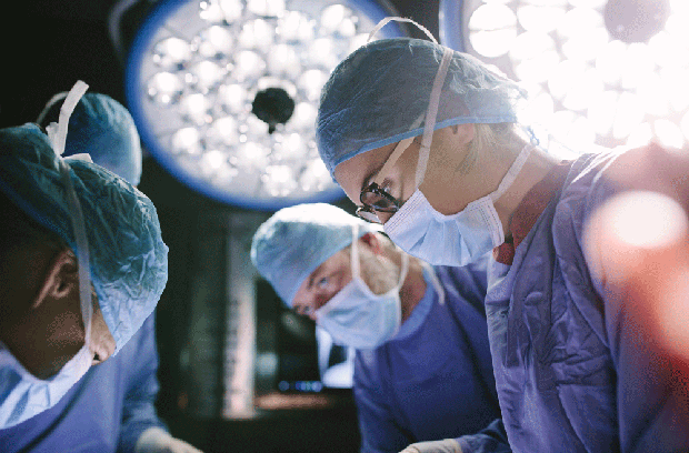 Four surgeons in the operating room