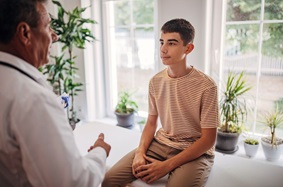 Teenager Talking to Senior Doctor
