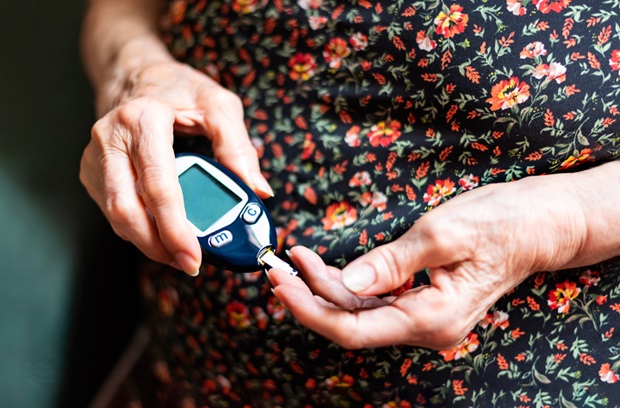 Older woman tracking her blood glucose levels