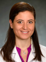 headshot of Mona Al Mukaddam, MD, MS