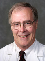 headshot of John S. J. Brooks, MD, FRCPath