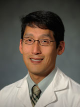 headshot of John H. Woo, MD