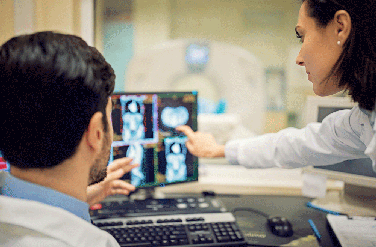 Doctors reviewing CT scan