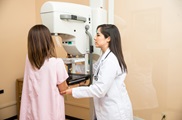 woman about to get a mammogram