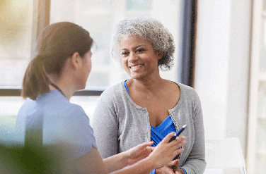 Woman smiling at female provider