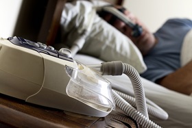 person sleeping while using cpap machine