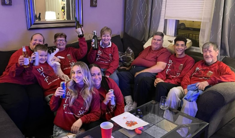 Kane Family Turkey Trot group celebrating on the sofa
