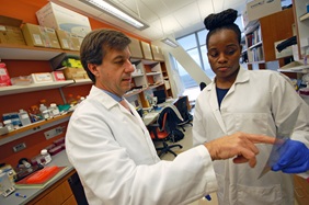 Pedro Gonzalez-Alegre, MD, PhD, pictured with research assistant Shareen Nelson (right) is working to position Penn as a leader in the area of neurogenetics.