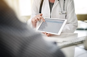 Doctor showing patient digital survey