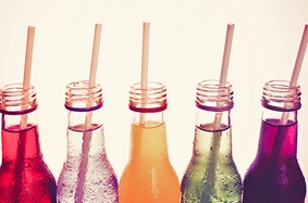 Glass bottles containing carbonated beverages