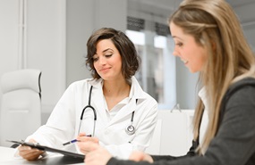 female doctor talking to patient