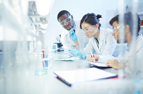 three researchers in a lab