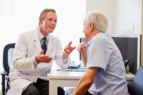 image of male doctor talking to male patient