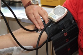 blood pressure being tested through the arm