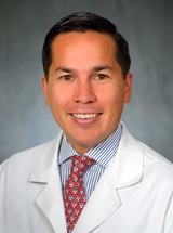 headshot of Alexander F. Au, MD