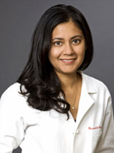 headshot of Meenakshi Bewtra, MD, MPH, PhD