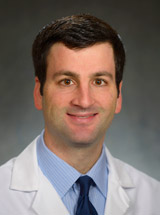 headshot of Adi Ganz, MD, MSc