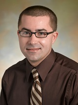 headshot of Christian L. Hermansen, MD, MBA