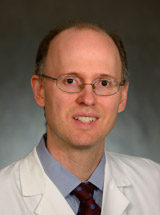 headshot of Eric Lancaster, MD, PhD