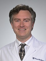 headshot of Joshua J. Larocque, MD, PhD