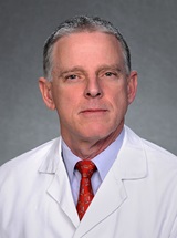 headshot of James Eric Russell, MD