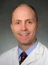 headshot of William D. Schweickert, MD