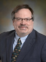 headshot of Joel W. Secrest, M.D., MD