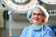 Dahlia Sataloff, MD, FACS, smiles in the operating room.