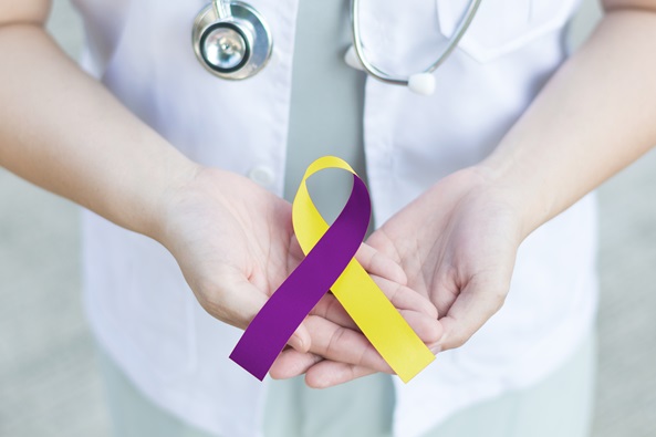 hands holding bladder cancer awareness ribbon