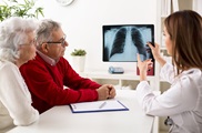Doctor shows x-ray of lungs from lung screening to patients