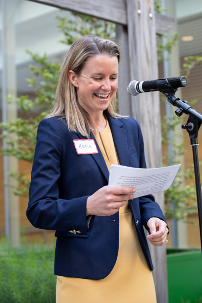 Katie Reuther speaking at a symposium