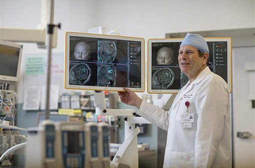 Dr. Steven Brem Looking at Brain Tumor Scans